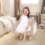 Vaikiškas supamas krėslas medinėmis kojomis ir minkšta sėdyne (Rožinė)