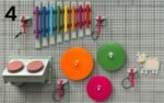 Edukacinė sienelė su muzikos instrumentais ir geometrinėmis detalėmis